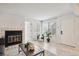 Bright living room with fireplace, wood-look floors, and natural light at 4804 E Kentucky Ave # D, Denver, CO 80246