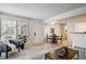 Bright living room features wood floors, neutral walls, and a large window at 4804 E Kentucky Ave # D, Denver, CO 80246