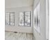 Bright living room with wood-look floors and large windows at 4804 E Kentucky Ave # D, Denver, CO 80246
