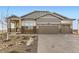 Charming home featuring a manicured lawn and a two-car garage at 3953 Treadway Pt, Castle Rock, CO 80108