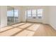 Bright living room featuring hardwood floors and a sliding glass door to a balcony at 3953 Treadway Pt, Castle Rock, CO 80108
