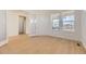 Bright office space with hardwood floors, glass french doors, and natural light at 3953 Treadway Pt, Castle Rock, CO 80108