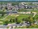 Scenic view of the ball field with beautiful landscaping, neighborhood townhomes, and a well-maintained parking lot at 8105 E Bayaud Ave, Denver, CO 80230