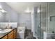 Spacious bathroom featuring a soaking tub, walk-in shower with tile accents, and a granite countertop vanity at 8105 E Bayaud Ave, Denver, CO 80230