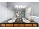 Bathroom featuring a double vanity with granite countertops and a large mirror reflecting the walk-in shower and decor at 8105 E Bayaud Ave, Denver, CO 80230