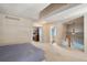 Spacious bedroom with a view of the ensuite bathroom and staircase, perfect for a luxurious living space at 8105 E Bayaud Ave, Denver, CO 80230