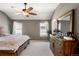 Serene bedroom with large windows and a neutral color scheme at 8105 E Bayaud Ave, Denver, CO 80230