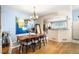 Charming dining room with stylish decor and a view into the kitchen at 8105 E Bayaud Ave, Denver, CO 80230