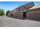 Row of townhomes with garages, showcasing architectural symmetry at 8105 E Bayaud Ave, Denver, CO 80230