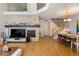 Spacious living room featuring hardwood floors, fireplace, and an open floor plan at 8105 E Bayaud Ave, Denver, CO 80230