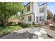 Lush backyard with mature trees, patio area, and well-manicured lawn, creating a serene outdoor retreat at 3835 Shefield Dr, Broomfield, CO 80020