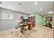 Finished basement with a well-organized home office space and a workout area at 3835 Shefield Dr, Broomfield, CO 80020