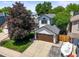Charming two-story home featuring a well-manicured lawn, a large shade tree, and an attached two-car garage at 3835 Shefield Dr, Broomfield, CO 80020