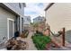 Cozy backyard features a hammock, garden beds, and a charming stone pathway at 21418 E Stroll Ave, Parker, CO 80138