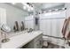 Bathroom featuring vanity with quartz countertop and black hardware at 21418 E Stroll Ave, Parker, CO 80138