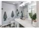 Stylish bathroom with modern fixtures, a large mirror, and a glass-enclosed shower at 21418 E Stroll Ave, Parker, CO 80138