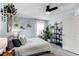 Bedroom with many plants, light grey walls, carpet, and a ceiling fan at 21418 E Stroll Ave, Parker, CO 80138