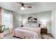 Comfortable bedroom featuring a cozy bed, ceiling fan, and ample natural light at 21418 E Stroll Ave, Parker, CO 80138