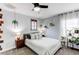 Bedroom featuring a window with curtains, and plants at 21418 E Stroll Ave, Parker, CO 80138