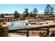 Community pool with covered gazebos, slide and fenced perimeter at 21418 E Stroll Ave, Parker, CO 80138