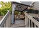 Cozy deck with outdoor chairs, flower pots, and a privacy curtain at 21418 E Stroll Ave, Parker, CO 80138