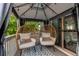Cozy deck with seating, neutral carpet, and outdoor string lights at 21418 E Stroll Ave, Parker, CO 80138