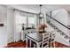 Cozy dining space filled with natural light, hardwood flooring and access to the staircase at 21418 E Stroll Ave, Parker, CO 80138