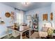 Bright home office with a white chair, wooden desk, and neutral carpet at 21418 E Stroll Ave, Parker, CO 80138