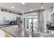 Well-lit kitchen featuring modern appliances, white cabinetry, updated countertops, and a sink at 21418 E Stroll Ave, Parker, CO 80138