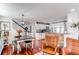 Open-concept living space with hardwood floors seamlessly connects the dining area and kitchen at 21418 E Stroll Ave, Parker, CO 80138