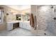 Luxurious primary bathroom with dual sinks, shower, and abundant counter space at 7931 W Paine Ave, Lakewood, CO 80235