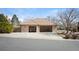 Spacious three-car garage with ample storage space and well-lit interiors at 7931 W Paine Ave, Lakewood, CO 80235