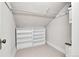 Attic space offers additional storage with shelving and neutral tones to complement any decor at 2096 S Logan St, Denver, CO 80210