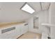 Bright attic closet with custom storage solutions and a skylight, maximizing functionality at 2096 S Logan St, Denver, CO 80210