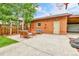 Brick backyard with outdoor seating area and basketball hoop, great for entertaining and recreation at 2096 S Logan St, Denver, CO 80210
