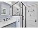 Bathroom includes a glass-enclosed shower, dual vanities, and modern finishes for a spa-like experience at 2096 S Logan St, Denver, CO 80210