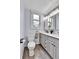 Bathroom offering dual vanities, modern fixtures, and natural light, designed for comfort and elegance at 2096 S Logan St, Denver, CO 80210