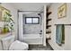 Elegant bathroom features a tub, shower, and open shelving for a modern and stylish design at 2096 S Logan St, Denver, CO 80210