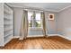 Cozy bedroom features hardwood floors, natural light, and ample space, perfect for relaxation at 2096 S Logan St, Denver, CO 80210