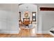 Elegant dining room featuring hardwood flooring, chandelier, and a charming fireplace at 2096 S Logan St, Denver, CO 80210
