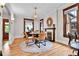 Bright dining space boasting hardwood floors, stylish lighting, and neutral color scheme at 2096 S Logan St, Denver, CO 80210