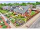 Charming two-story home with colorful garden landscaping and a well-maintained yard at 2096 S Logan St, Denver, CO 80210