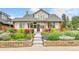 Well-maintained home boasts professionally landscaped front yard and cozy entryway at 2096 S Logan St, Denver, CO 80210