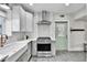Modern kitchen with stainless steel appliances, quartz countertops, and stylish hardware at 2096 S Logan St, Denver, CO 80210