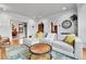 Cozy living room showcasing hardwood floors, modern decor, and ample seating at 2096 S Logan St, Denver, CO 80210