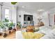 Modern living area with stylish accents, hardwood floors, and neutral wall color at 2096 S Logan St, Denver, CO 80210