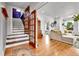 Inviting living room with hardwood floors and a staircase, perfect for a welcoming home atmosphere at 2096 S Logan St, Denver, CO 80210