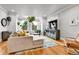 Bright living room with hardwood flooring, neutral decor, and modern furniture at 2096 S Logan St, Denver, CO 80210