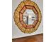 Close up view of a decorative mirror on the wall above the fireplace at 2096 S Logan St, Denver, CO 80210