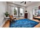 Home office with hardwood floors, a large window and comfortable seating arrangement at 2096 S Logan St, Denver, CO 80210